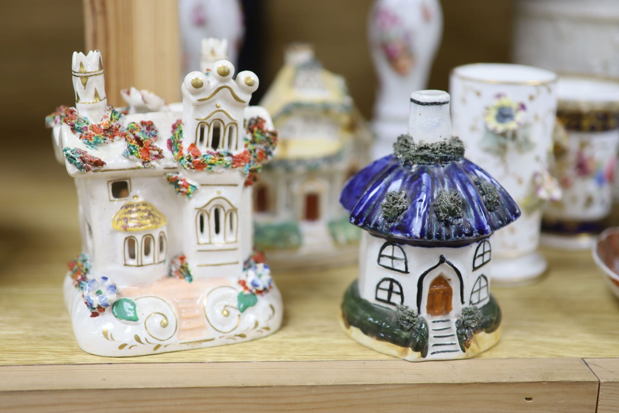 A group of mixed ceramics including a Copeland flower-painted vase, a Staffordshire hen and chick tureen and cover, Staffordshire cot